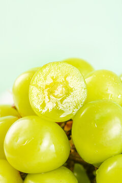 Fresh Green Seedless Grapes Cut in Half Showing Juicy Interior - Healthy Organic Fruit