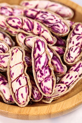 Fototapeta premium Fresh Purple Striped Peanuts from Yunnan Plateau in Wooden Bowl - Natural Healthy Legumes