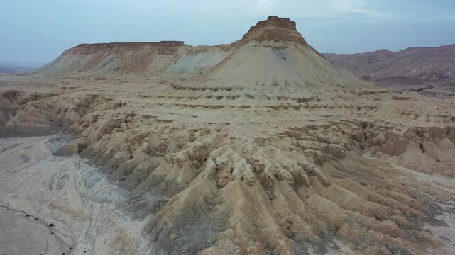Aerial view of the rugged terrain and eroded slopes of Mount Zin in the Negev desert near Yeruham, South District, Israel.