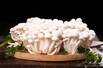 Fresh White Jade Mushrooms from Yunnan China on Wooden Board with Herbs © NguyenVan