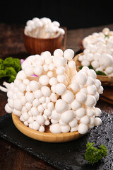 Fresh White Jade Mushrooms from Yunnan - Premium Edible Fungi on Wooden Plate for Gourmet Cooking © NguyenVan