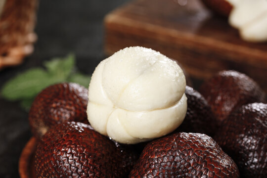 Indonesian Snake Fruit Salak with White Flesh and Scaly Brown Skin - Fresh Tropical Exotic Fruit from Southeast Asia