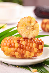 Sweet Glutinous Corn from Yunnan China - Fresh Golden Jade Colored Small Kernels on White Plate © CanVan