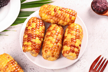 Yunnan Glutinous Jade Corn Cobs - Traditional Sweet Savory Small Variety on White Plate © CanVan