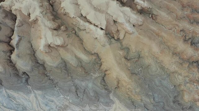 Aerial view of the rugged, eroded limestone cliffs and dry wadis of Mount Zin in the Negev desert, Yeruham, South District, Israel.
