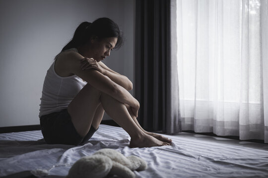A distressed woman facing abuse and human trafficking, showing tears, depression, emotional pain, and a message of protection and hope.