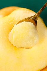 Freshly Picked Golden Apple with Spoon Closeup - Fresh Fruit Detail © KieuThi