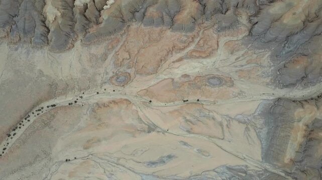 Aerial view of the dry riverbeds and rocky terrain of Mount Zin in the Negev desert near Yeruham, South District, Israel.