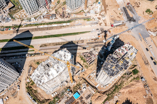 construction works on a building site of new apartment houses. aerial view from above.