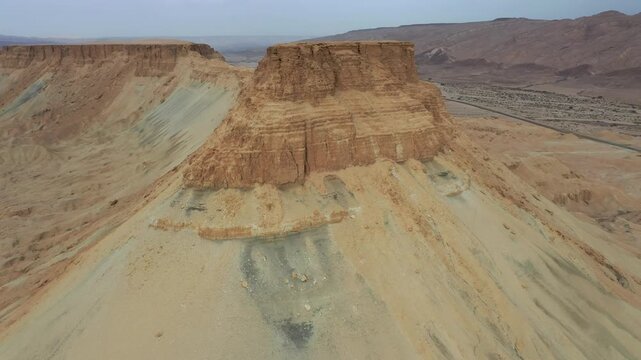 Aerial view of the rugged cliffs and arid landscape of Mount Zin in the Negev desert, Yeruham, South District, Israel.