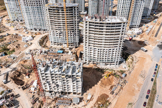 construction of high-rise apartment buildings in new urban residential area. aerial drone view.