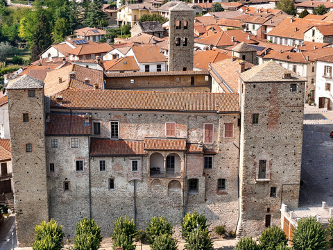 Aerial view of the historic castle with its stone walls, towers, and terracotta rooftops Monastero Bormida, Piedmont, Italy.