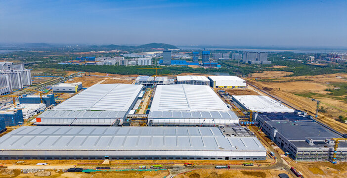 Aerial Factory Complex with Construction Progress - Industrial Manufacturing Site