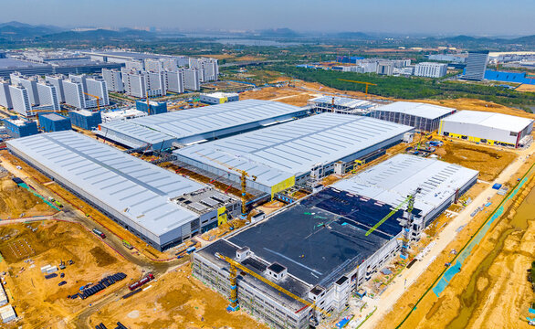 Aerial Industrial Factory Construction Site with Warehouse Buildings