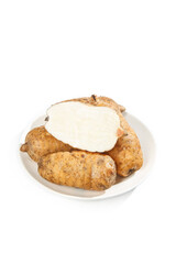 Fototapeta premium Fresh Selenium-Enriched Tubers from Zhaotong China on White Plate