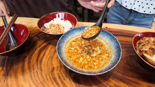 Spoonful of Spicy Mapo Tofu Stew Over White Rice