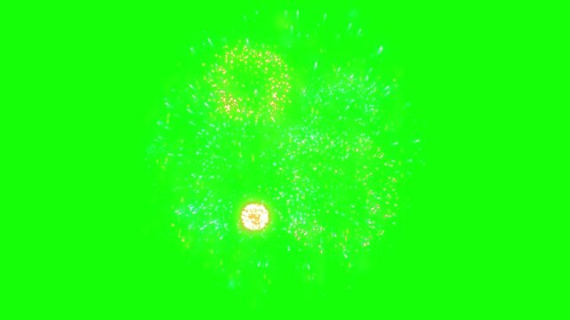 Fireworks burst effect features vibrant ring-shaped sparks and glowing light particles isolated on a green screen background.