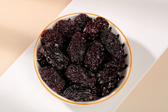Dried Black Jujube Dates from Xinjiang China in Bowl - Traditional Asian Superfood