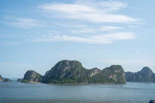 Serene view of lush, green islands under a clear blue sky.