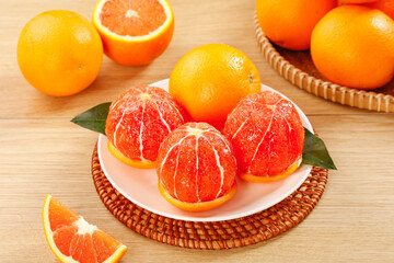 Fresh Blood Oranges and Citrus Fruits Display on Wooden Table with Natural Light © Nguyen