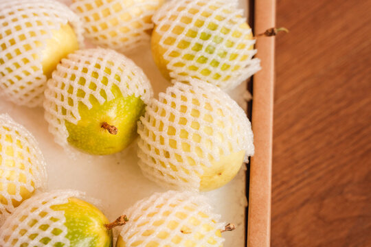 Fresh Golden Passion Fruit from Guangxi China in Protective Packaging Closeup