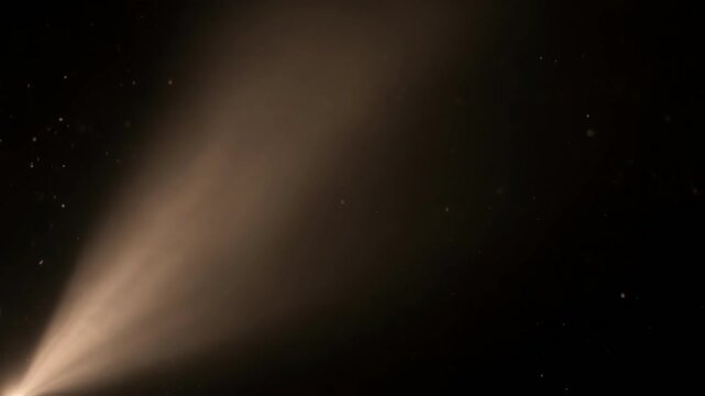 Soft brown light beam fading into black background