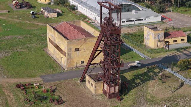 Steel Pithead Frameheads (headframes) Of The Historic Serbariu Coal Mine (Grande Miniera di Serbariu) In Carbonia, Sardinia, Italy. Aerial Shot