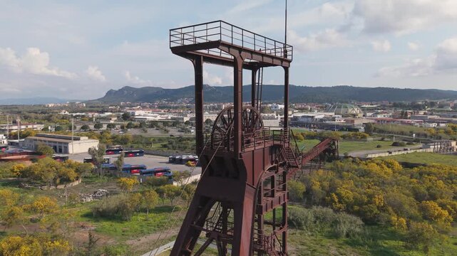 Historic Headframes At Serbariu Coal Mine In Carbonia, Sardinia, Italy. - aerial closeup shot