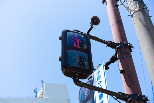 Low angle view of Japanese pedestrian traffic signal showing red light with copy space in Fukuoka, Japan
