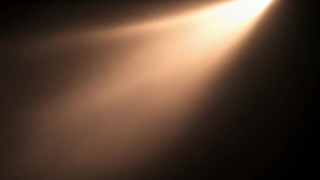 Soft, warm light beam fading into dark background