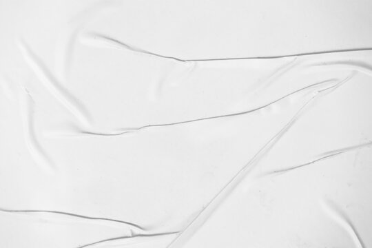 Crumpled paper texture overlay effect PNG, white paper wrinkled poster template, blank glued creased paper sheet mockup. white poster mockup on wall.