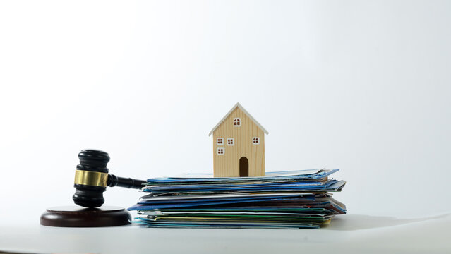 Wooden gavel house model real estate compliance law document paper auction justice contract legal property order decision serious security policy
