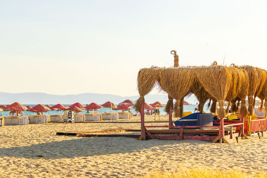 Beach lounge on cunda island coast. Concept of recreation, hospitality, wellness, vacation and coastal lifestyle.