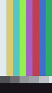 A television test pattern with colorful vertical bars, gray and black bars at the bottom, designed for calibration and alignment