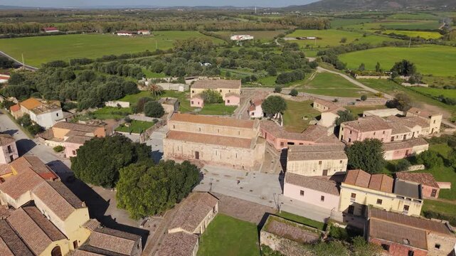 Cattedrale di Santa Maria di Monserrato And The Ghost Town In Tratalias Vecchia, Sulcis Iglesiente, Italy. - aerial shot