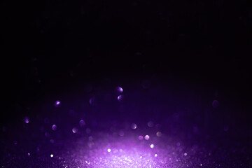 Dark purple glitter background with glowing bokeh for Halloween, Mardi Gras, birthday party banner or festive backdrop © Svetlana Kolpakova