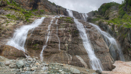 Beautiful waterfalls cascade down the cliff. North Caucasus, Russia. © Sergei