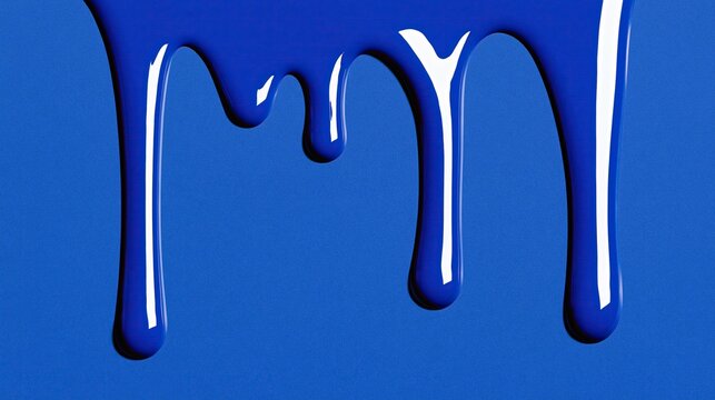 Glossy bright blue paint dripping down over matching solid blue background showing smooth wet glossy liquid paint drips in modern abstract art style