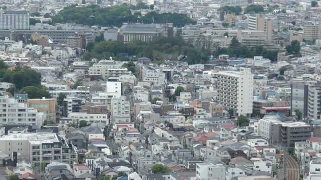 Footage panning from right to left over a bird's-eye view of a residential area in Setagaya, Tokyo.