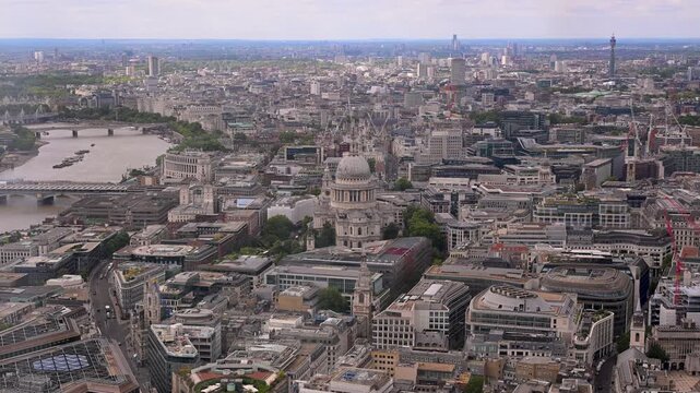 St Paul&rsquo;s Cathedral dominates a wide daytime London skyline with the River Thames, BT Tower and dense urban streets below.
