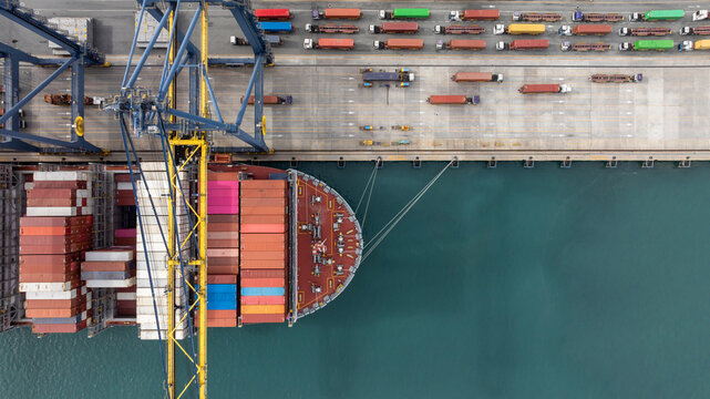 Aerial view Container cargo ship loading unloading container import export sea port, Global trade business container cargo ship freight shipping commercial trade logistic transportation international.