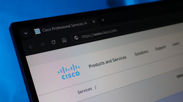 Cisco website interface on computer monitor for networking and professional services.