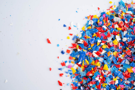 Plastic colorful pieces recycling shredded for industrial use.