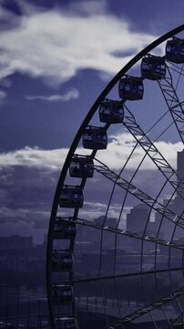 A giant Ferris wheel rises against a vividly colored evening sky. Clouds swirl dramatically as dusk settles over the city, creating a breathtaking scene filled with anticipation and wonder.