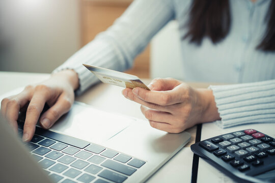 person pay bills via mobile banking at home