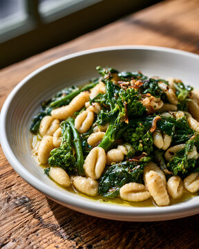 Cavatelli Pasta with Broccoli Rabe and Anchovy on Rustic Wooden Table