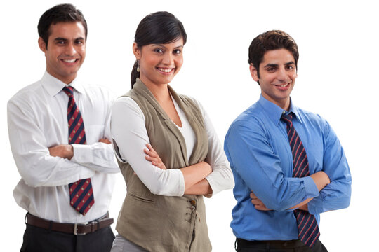 Three professionals smiling with arms crossed 