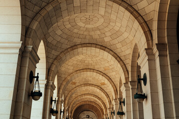 Fototapeta premium Stone arches create geometric patterns in historic architecture.