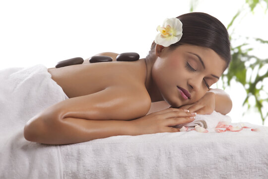 Close-up of woman getting lastone treatment 