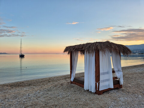 Serene sunset at Orikum beach in Vlor&euml;, Albania with a cozy hut by the sea